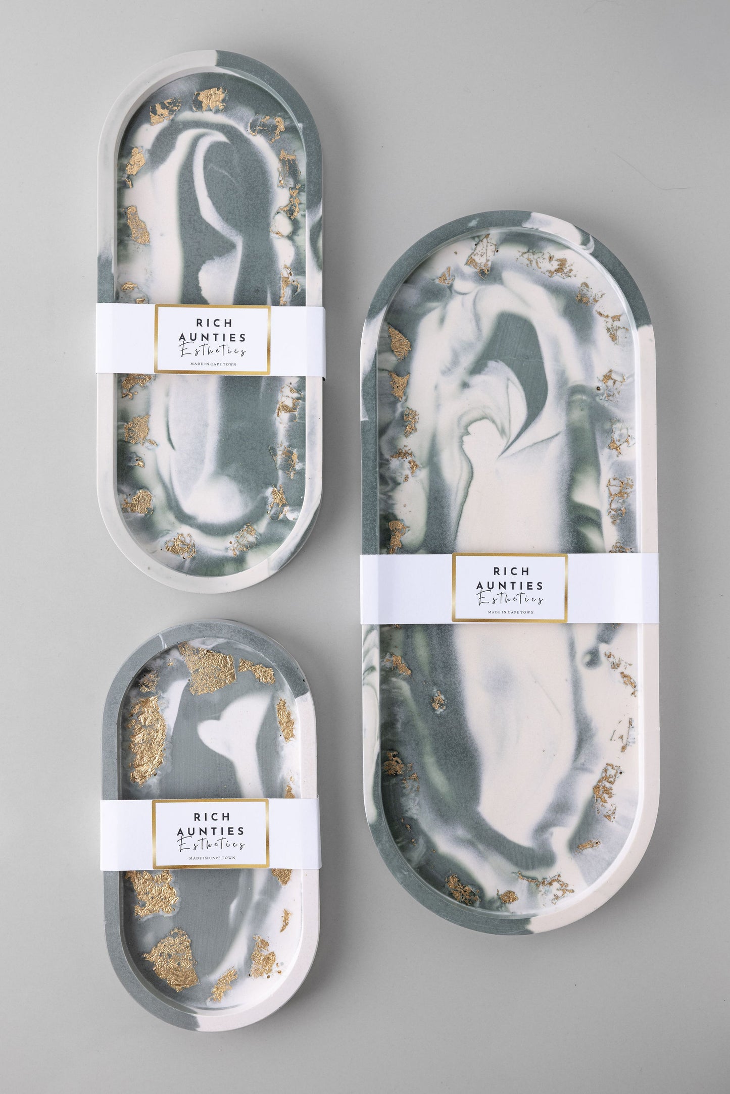Rich Aunties Esthetics 3-piece green marble Jesmonite trinket tray set with gold leaf, featuring a premium high-gloss finish and natural cork backing.