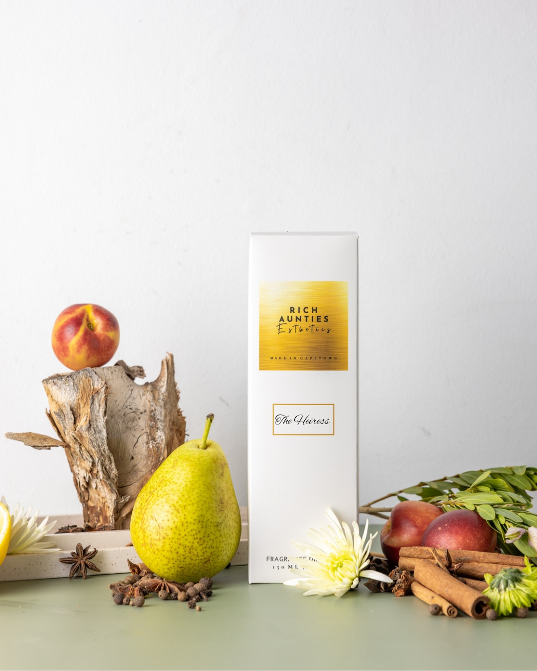 Rich Aunties Esthetics luxury 150ml Heiress wood oriental reed diffuser featuring Laotian oud and rose notes in a square glass bottle in a whitebox