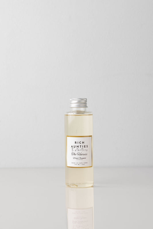 Rich Aunties Esthetics luxury 125ml Heiress woody oriental diffuser fragrance oil refill in a clear plastic bottle with a silver cap.