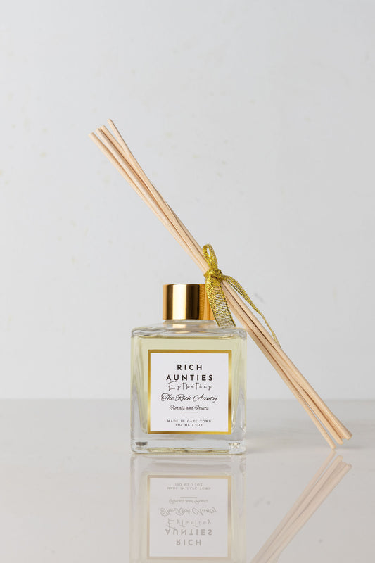 Rich Aunties Esthetics luxury 150ml fruits and florals reed diffuser in a square glass bottle and gold cap with natural sticks and soft touch box