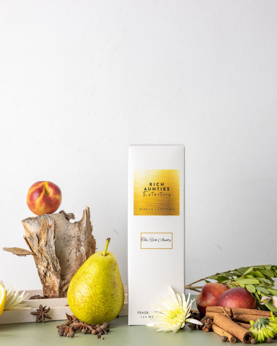 Rich Aunties Esthetics luxury 150ml fruits and florals reed diffuser in a square glass bottle and gold cap with natural sticks and soft touch box